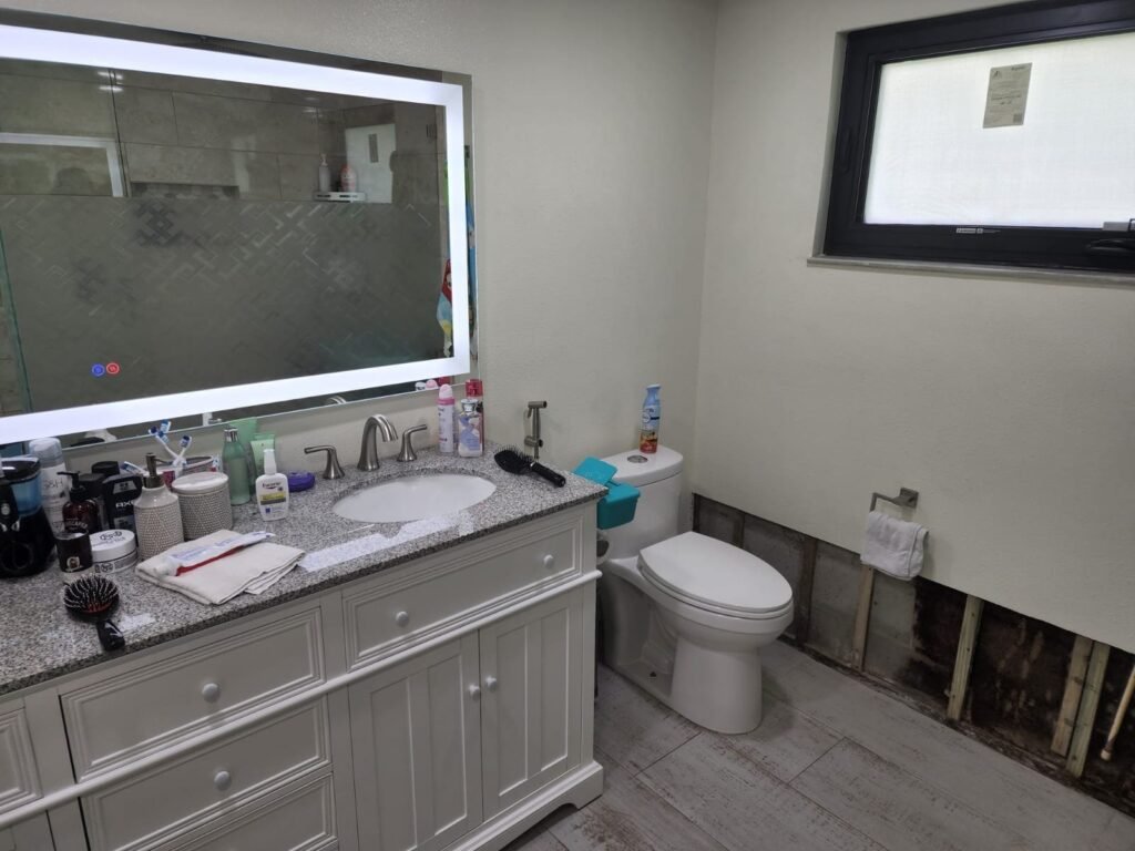 Completed bathroom with vanity and toilet in Tampa, FL 33624.
