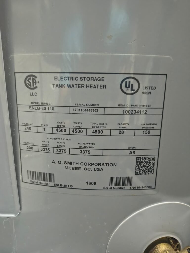 The rating label on an A.O. Smith electric tank, showing the model and serial number, in Tampa, FL 33602.