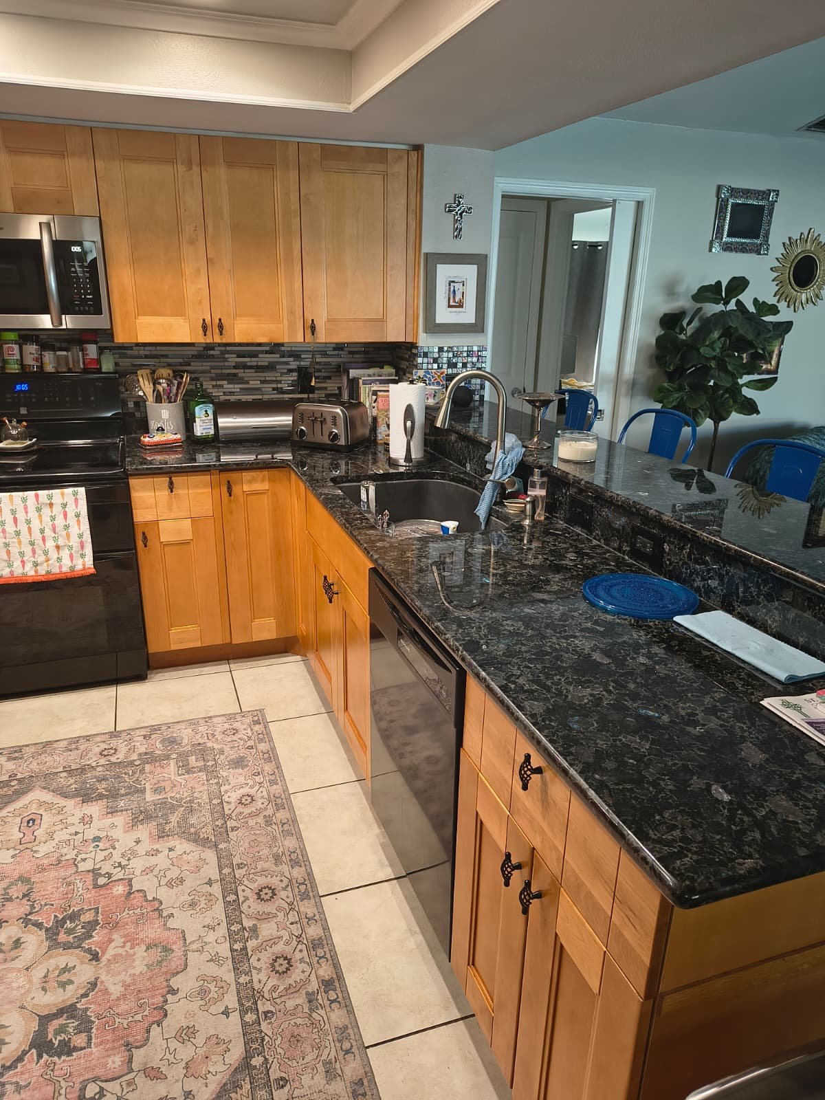 Completed kitchen with new plumbing fixtures in Tampa, FL 33624. New water supply installation.