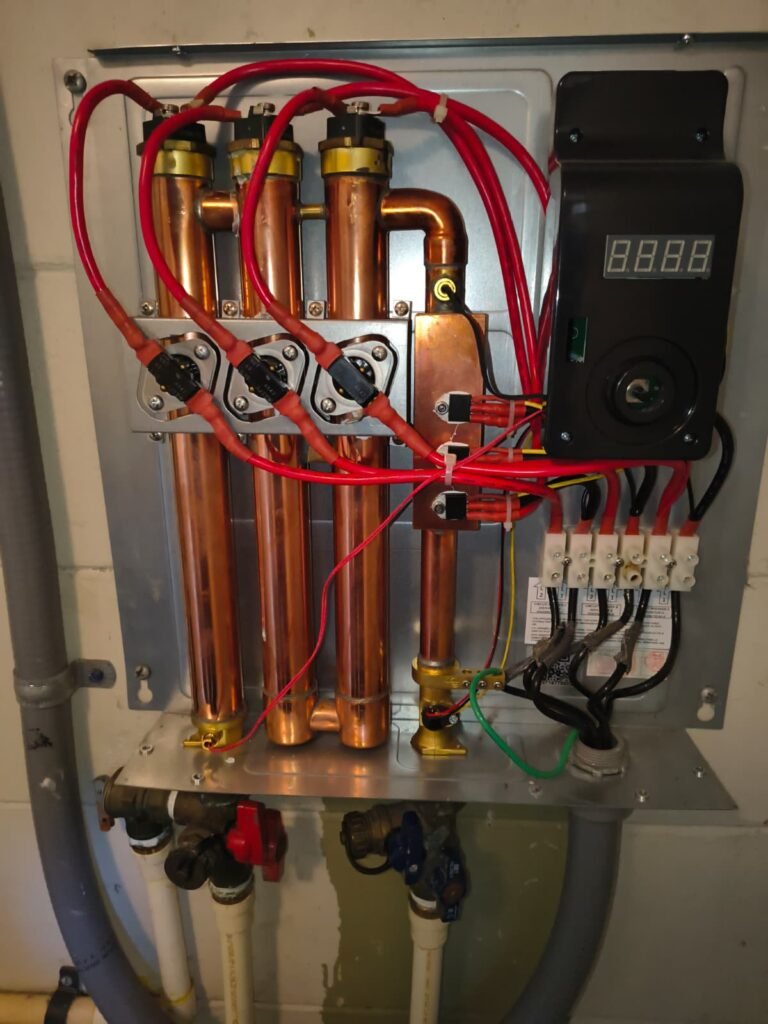 Detailed view of water heater components and wiring in Tampa, FL 33624.