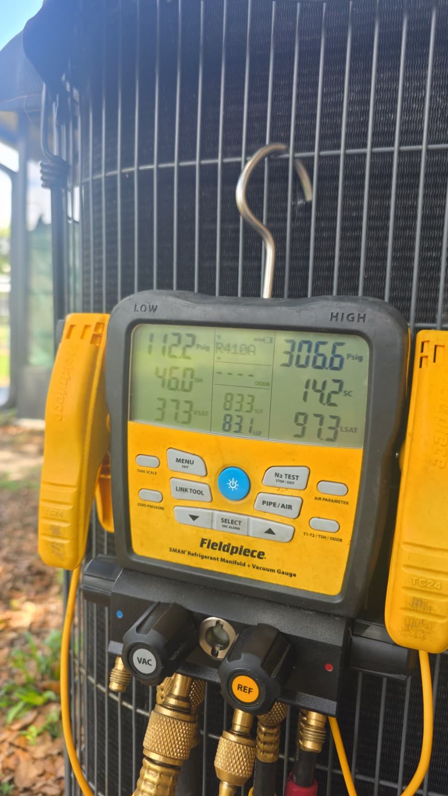 Digital gauge showing AC pressure readings during Premium Home Therapy in Brandon, FL 33511.