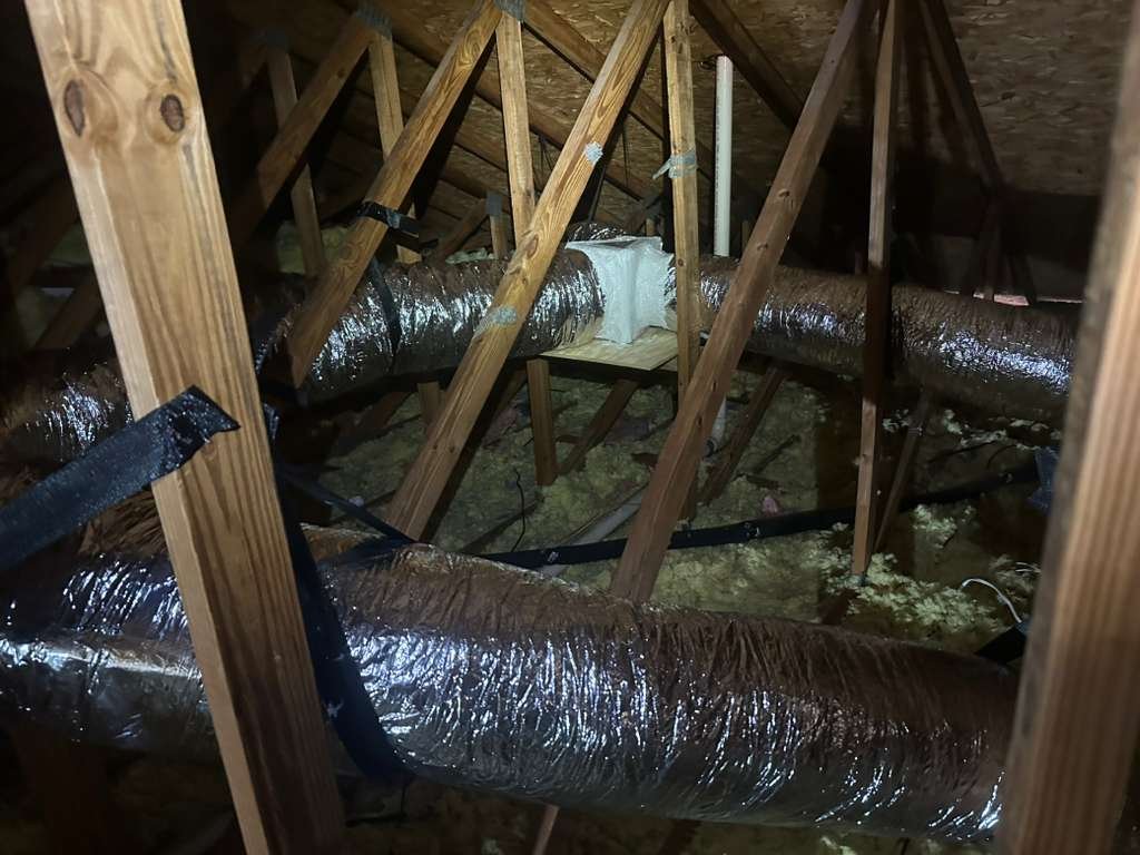 In-progress overview of ductwork installation in attic for R6 Flex replacement in Tampa, FL 33624.