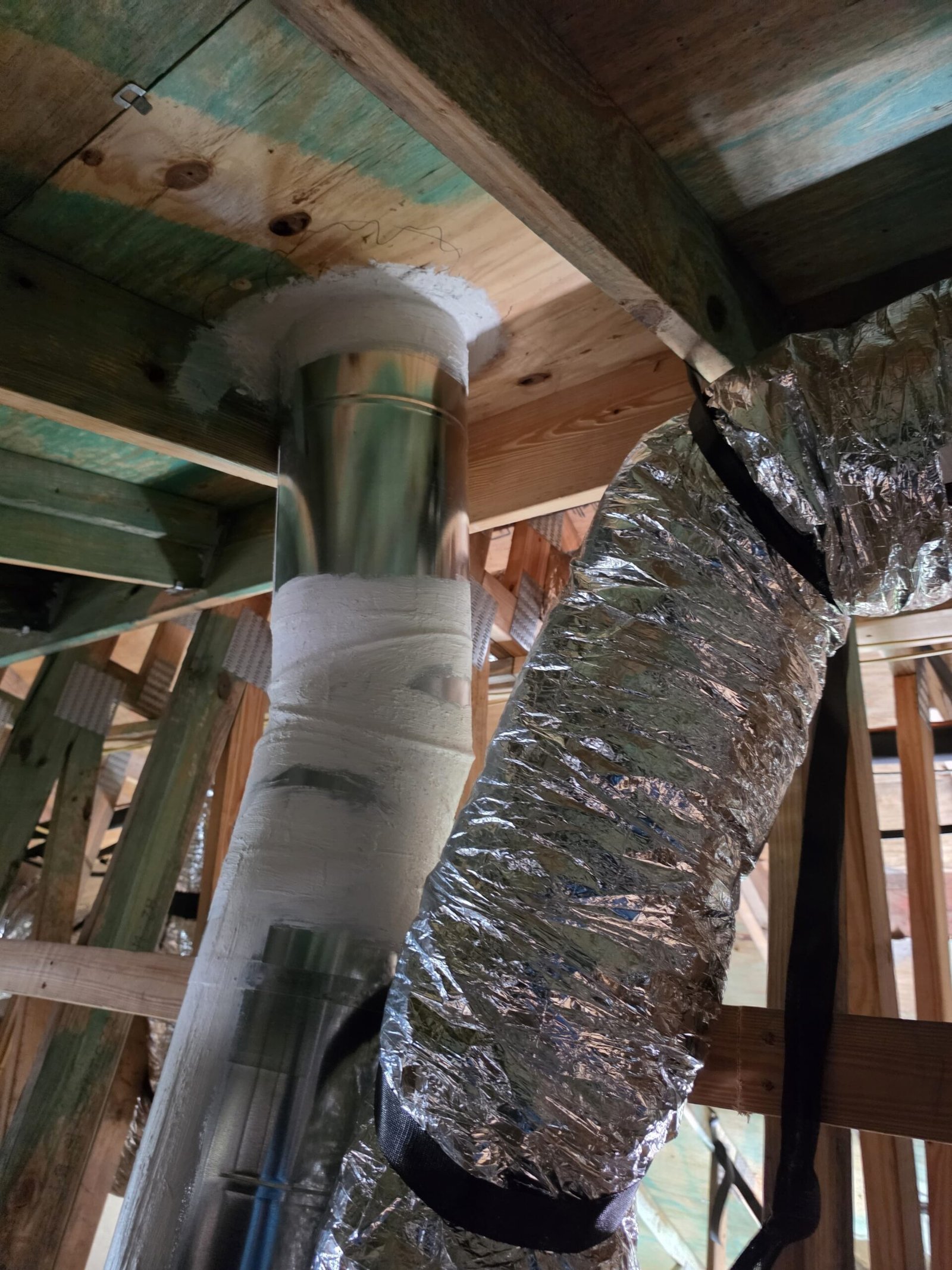 In-progress ductwork with insulation and sealant in ceiling, St. Petersburg, FL 33712.