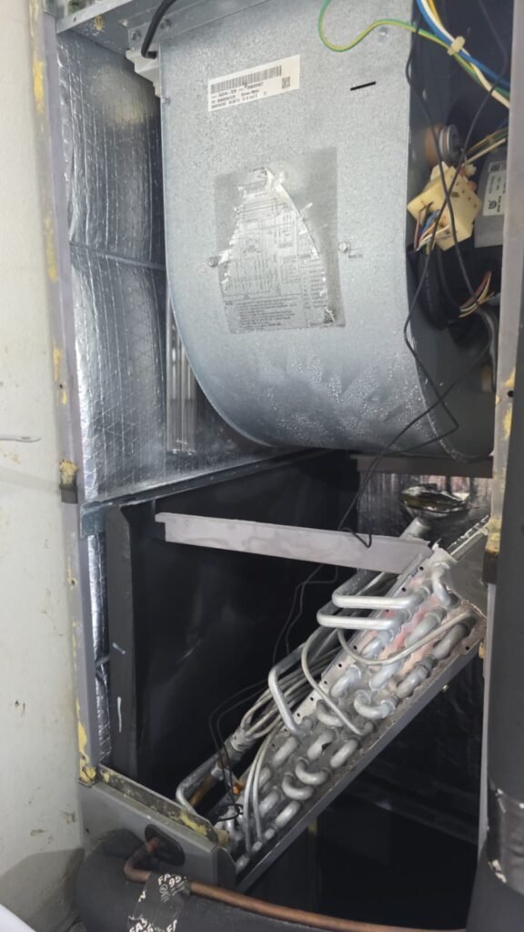 Exposed HVAC evaporator coils inside unit in New Port Richey, FL 34654.
