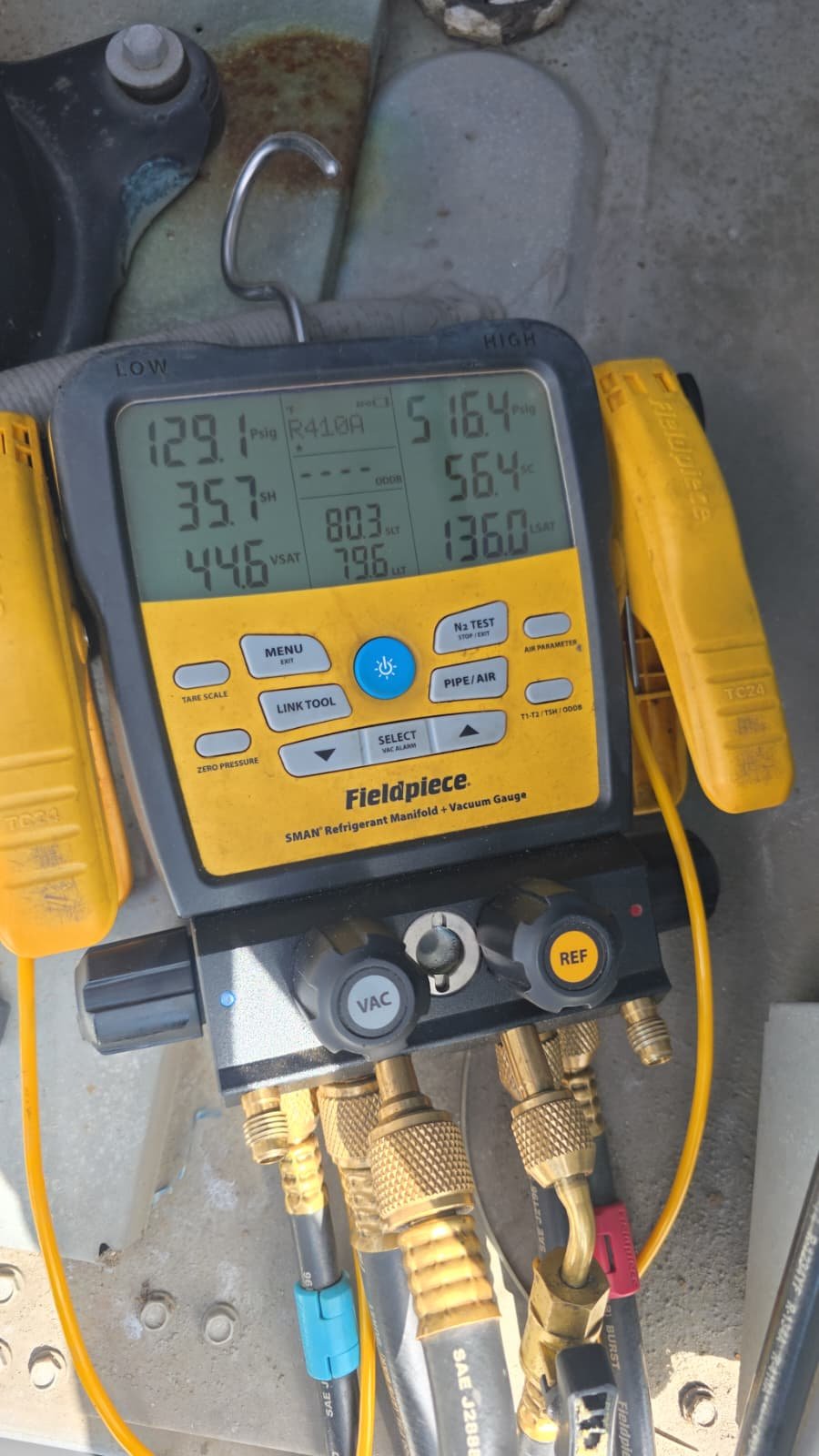 Fieldpiece refrigerant manifold gauge set during Premium Quarterly Service in Riverview, FL 33578.