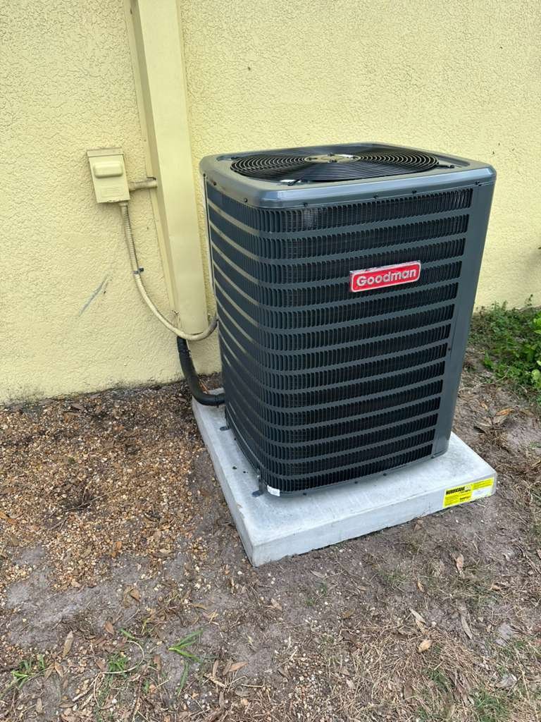 A new Goodman condenser on its pad in Tampa, FL 33624.