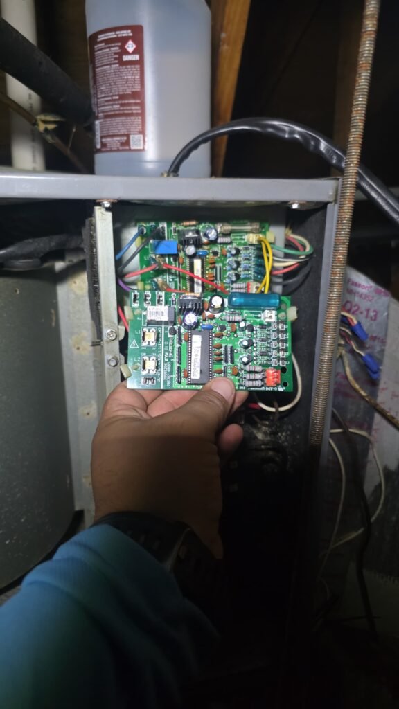 A control board inside an indoor unit during a heating repair in Tampa, FL 33604.
