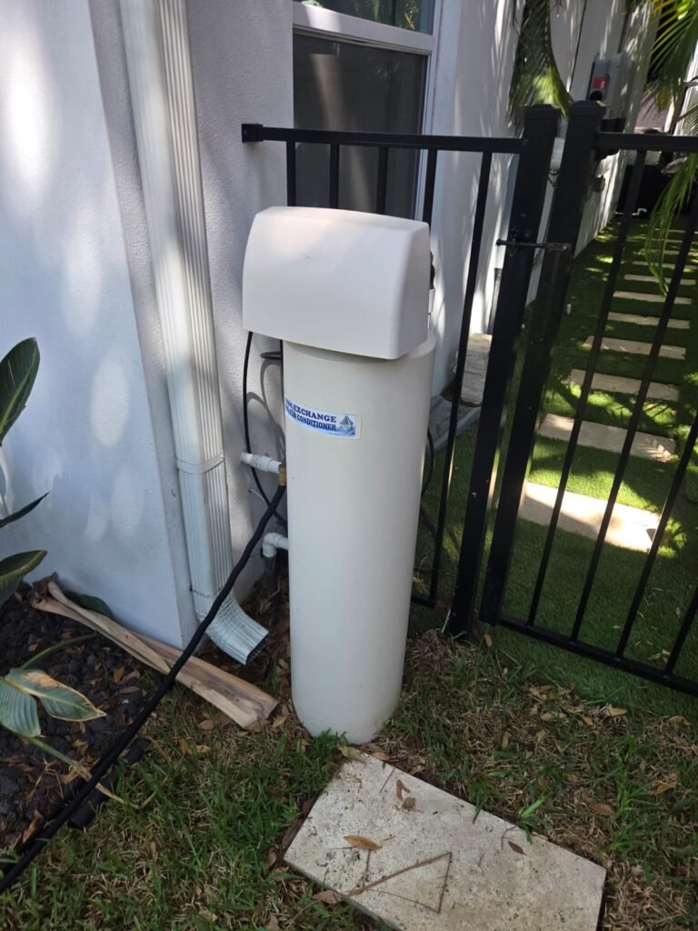 A water softener installed beside a home in Tampa, FL 33606.