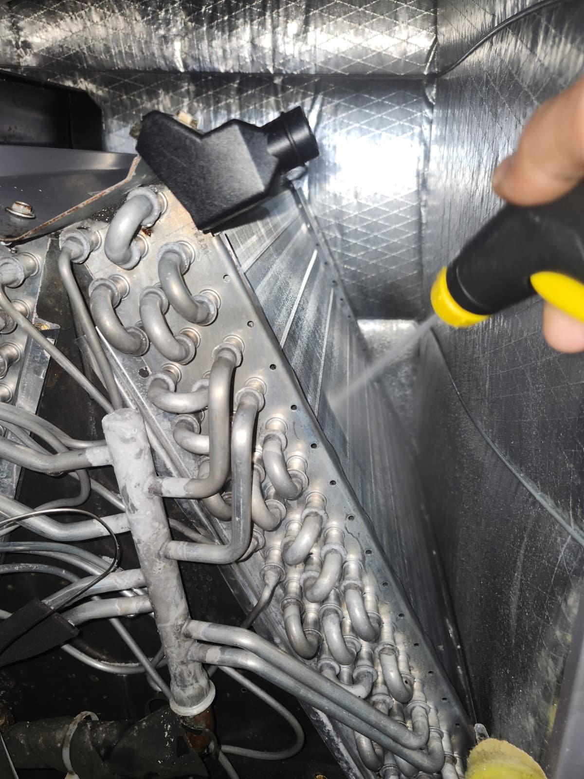 Premium Therapy Plan AC coil cleaning with spray bottle in Tampa, FL 33624.