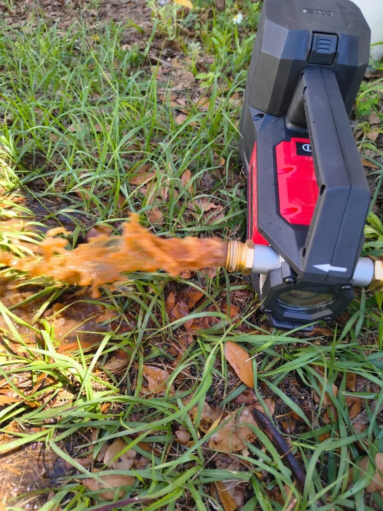 Rust-colored water flushing out through a hose in Brandon, FL 33511.
