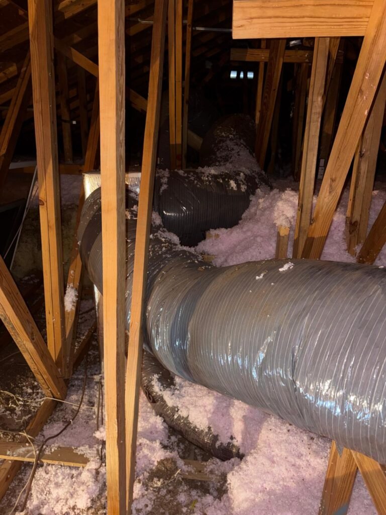 Attic view of ductwork installation with insulation in Odessa, FL 33556.