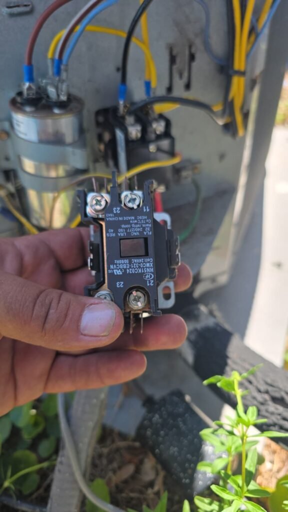 Close-up of a contactor near an electrical panel in Tampa, FL 33624. Contactor replacement service.