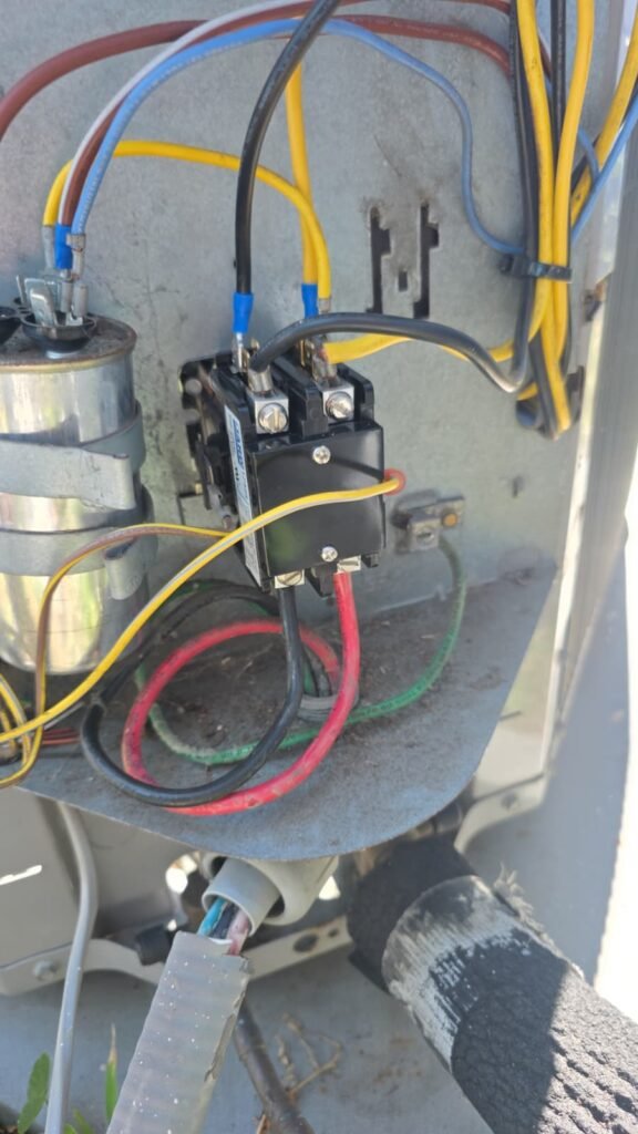 Wiring and contactor inside an electrical panel in Tampa, FL 33624. HVAC repair service.