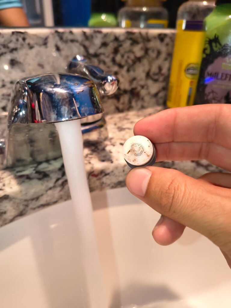 A faucet aerator being swapped at a bathroom sink in Brandon, FL 33511.