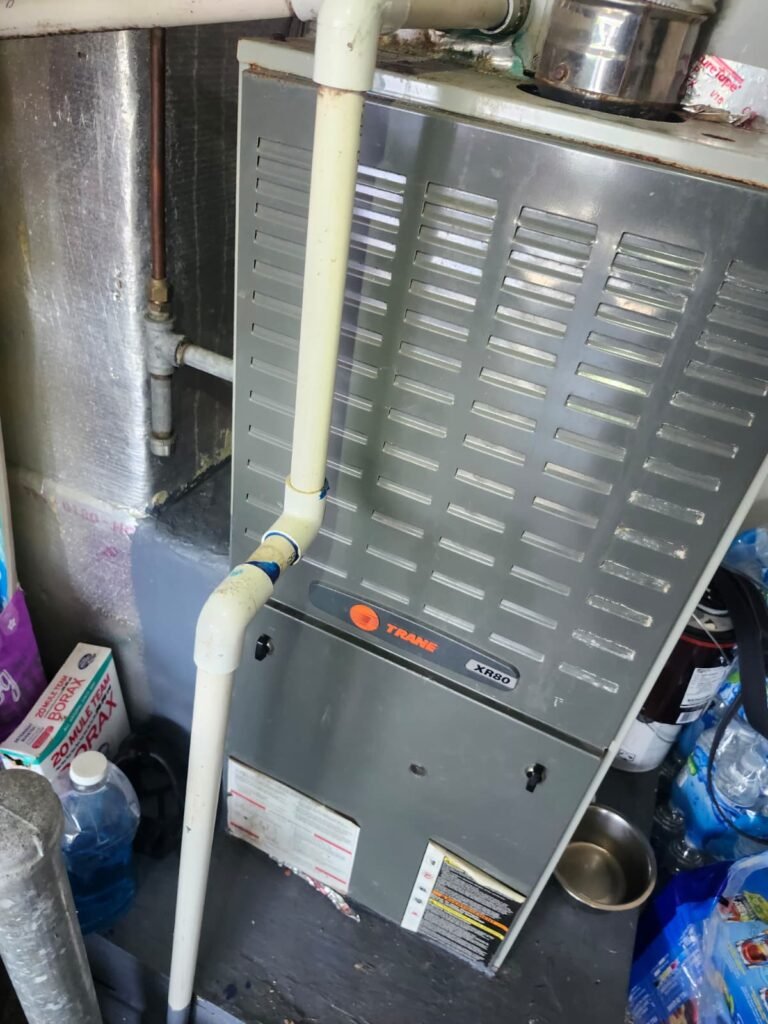 A Trane gas furnace installed in a utility space in Wesley Chapel, FL 33543.