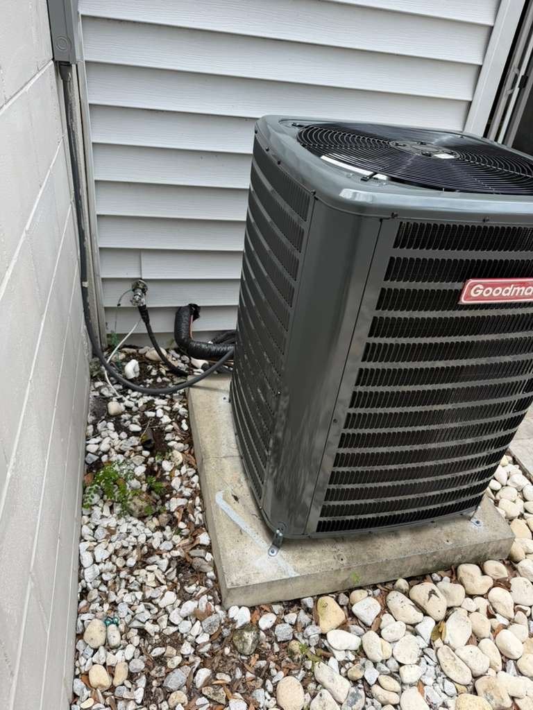 Installed Goodman AC unit beside house, Tampa, FL 33629.