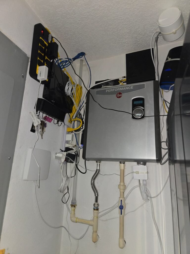 Interior view of tankless water heater with wiring in Tampa, FL 14511. Cost of Parts service.