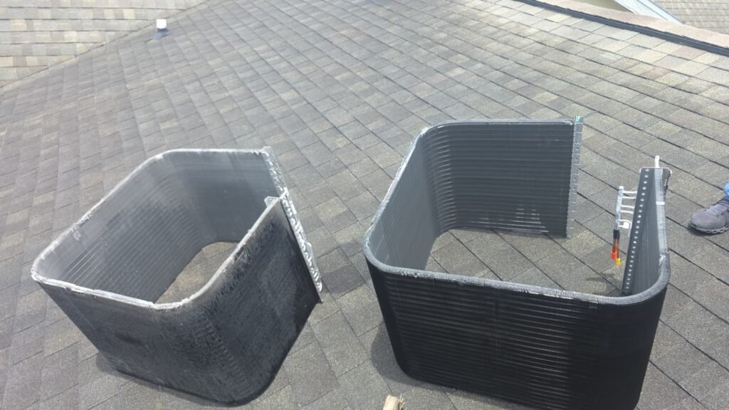 Old and new condenser coils on rooftop for replacement in Tampa, FL 33605.