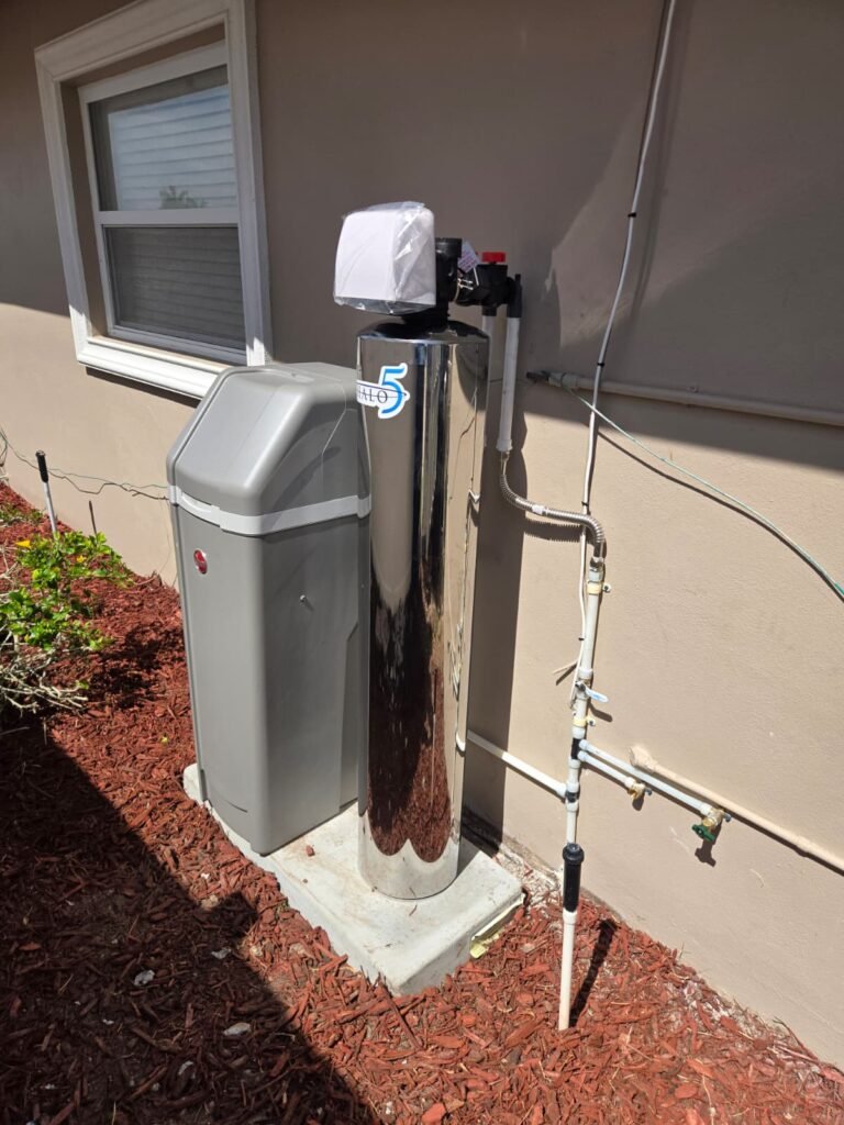 Side view of installed water softener system in New Port Richey, FL 34652.