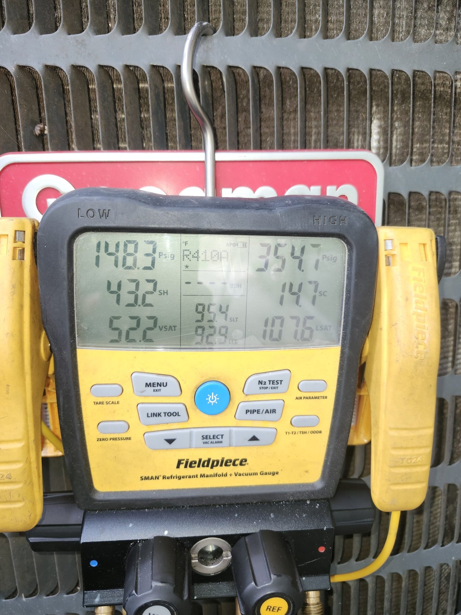Digital manifold gauge displaying readings on AC unit in Lutz, FL 33559. In-progress diagnostics.