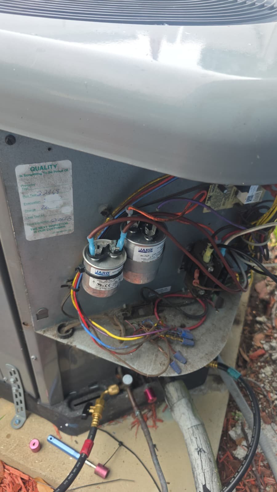 Open AC unit showing components and wiring in St. Petersburg, FL 33710.