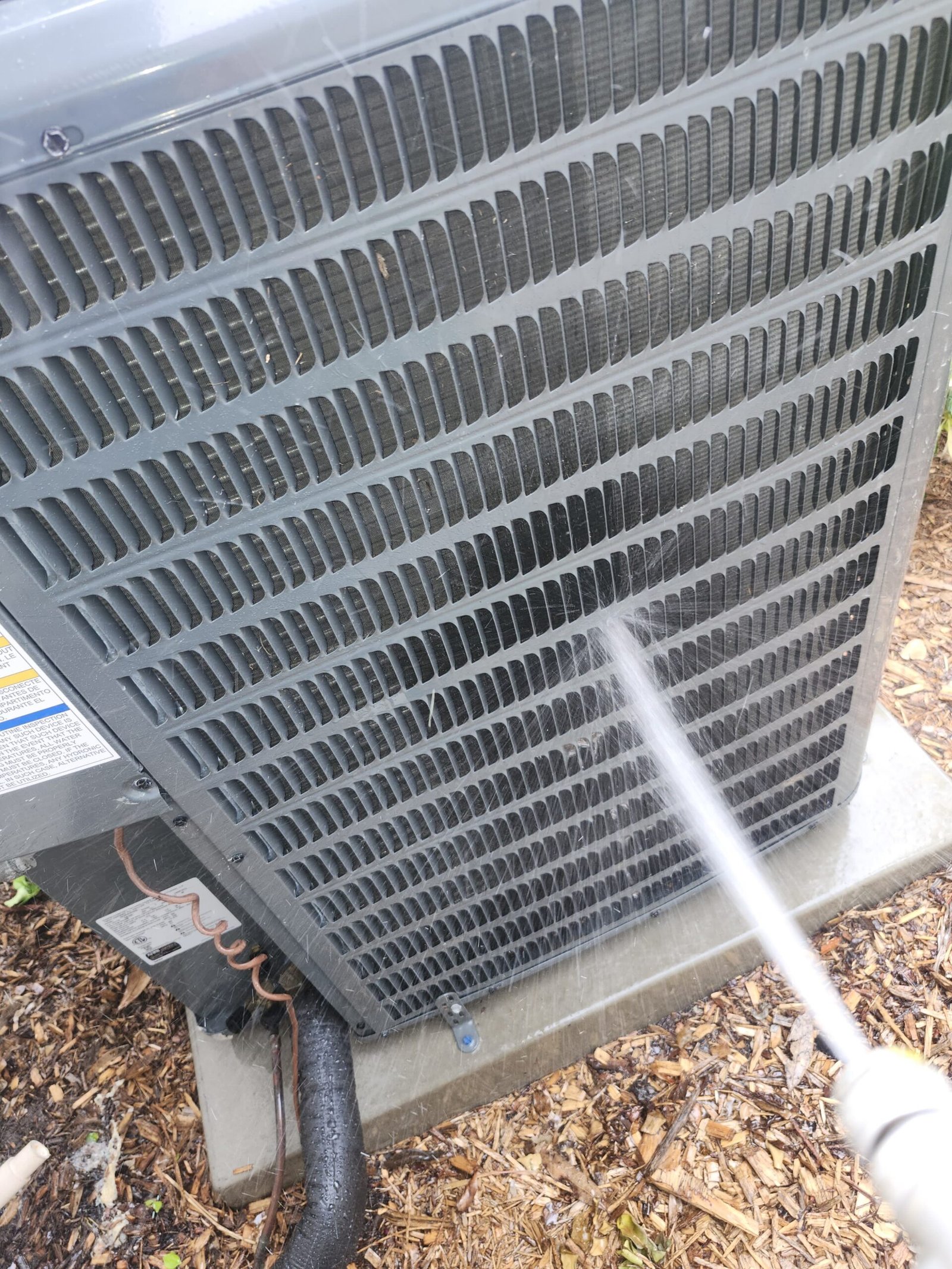 AC Unit Fins Cleaning - Palm Harbor, FL 34684 Water spray cleaning AC unit fins, Visit #4, Palm Harbor, FL 34684.