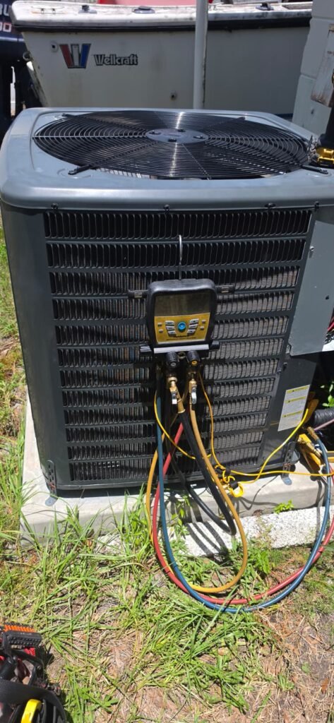 Checking refrigerant pressures on a Goodman condenser in Tampa, FL 33611.