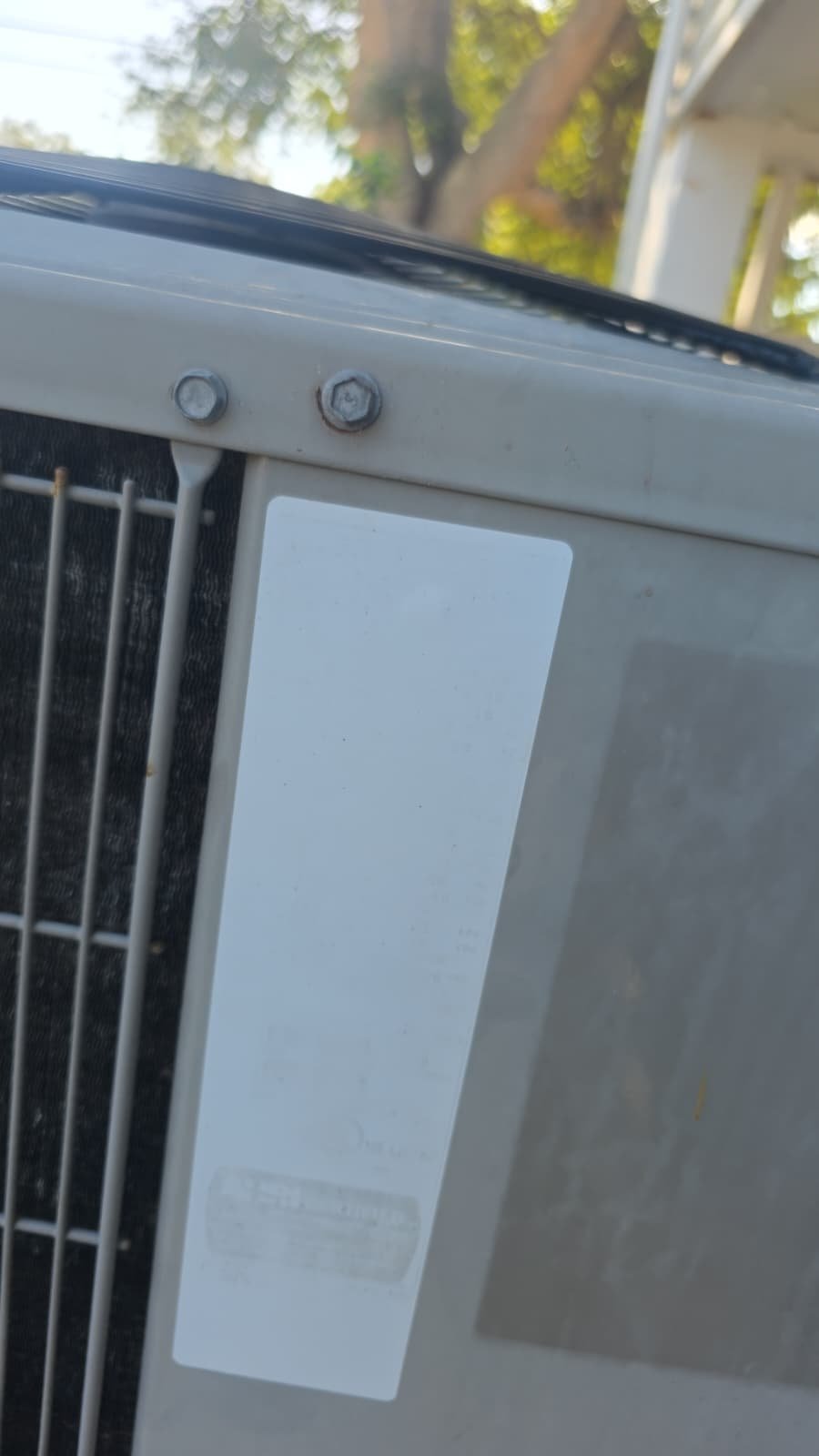 Close-up of AC unit label in St. Petersburg, FL 33703.