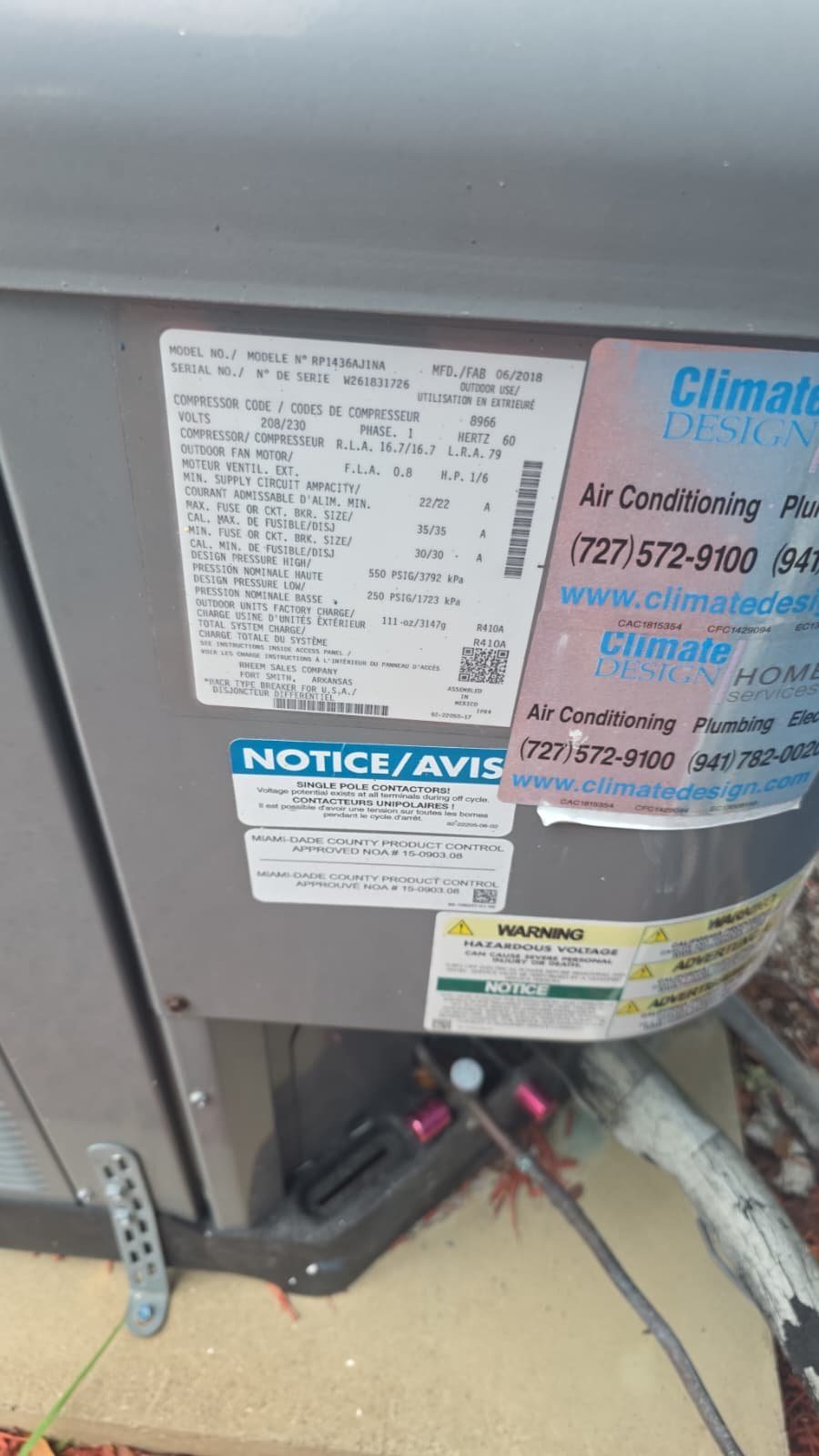 Close-up of AC unit's label and warning stickers in St. Petersburg, FL 33710.