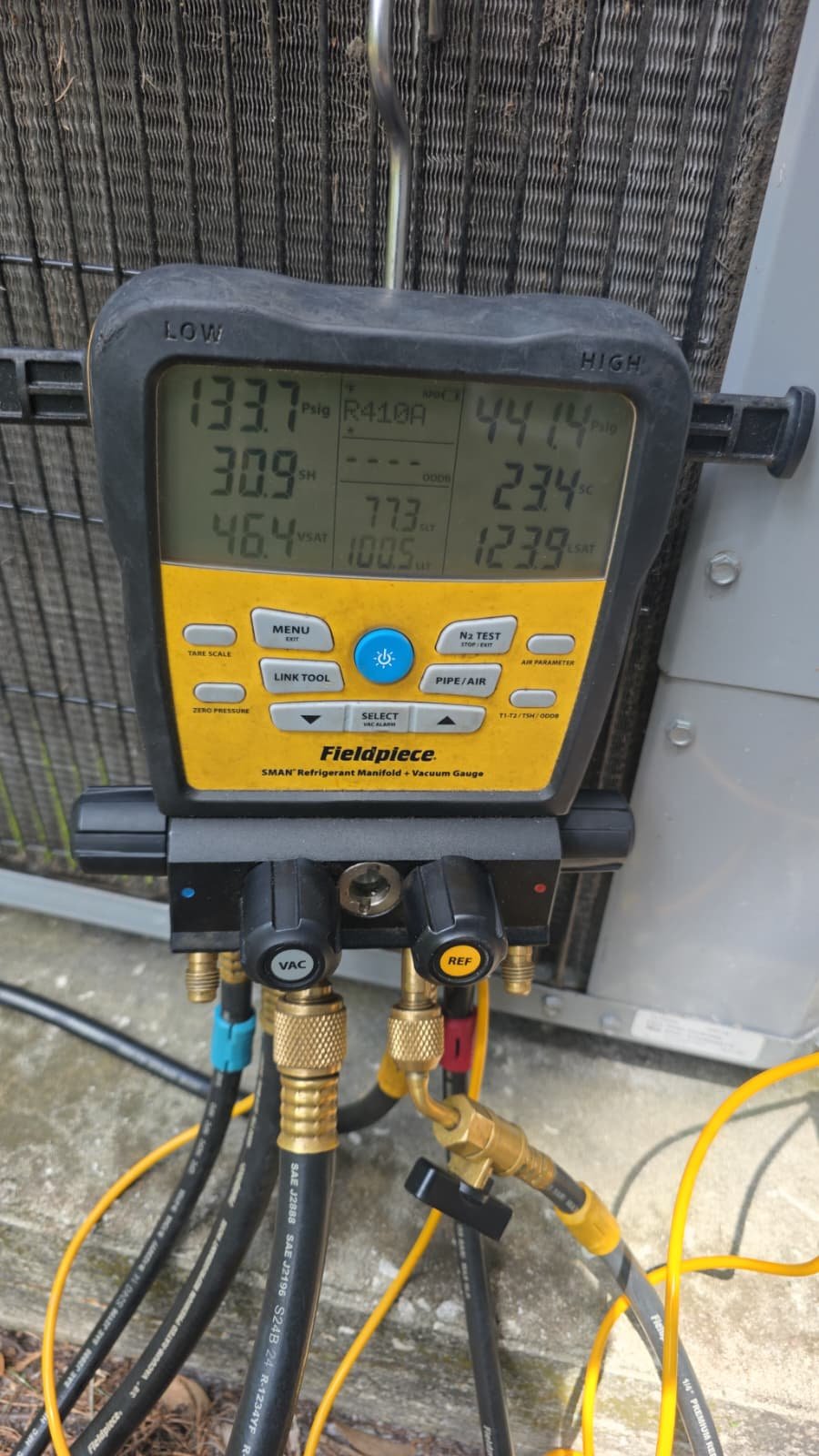 AC Unit Testing - Lutz, FL 33558 Fieldpiece digital manifold gauge set in use on AC unit in Lutz, FL 33558.