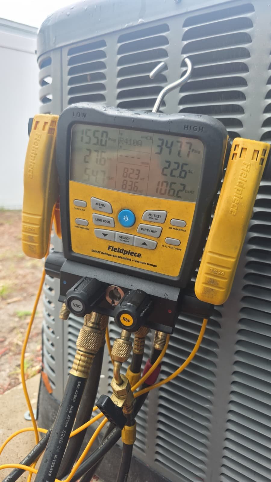 Gauges testing AC unit during System repair Lv.2 in St. Petersburg, FL 33710.