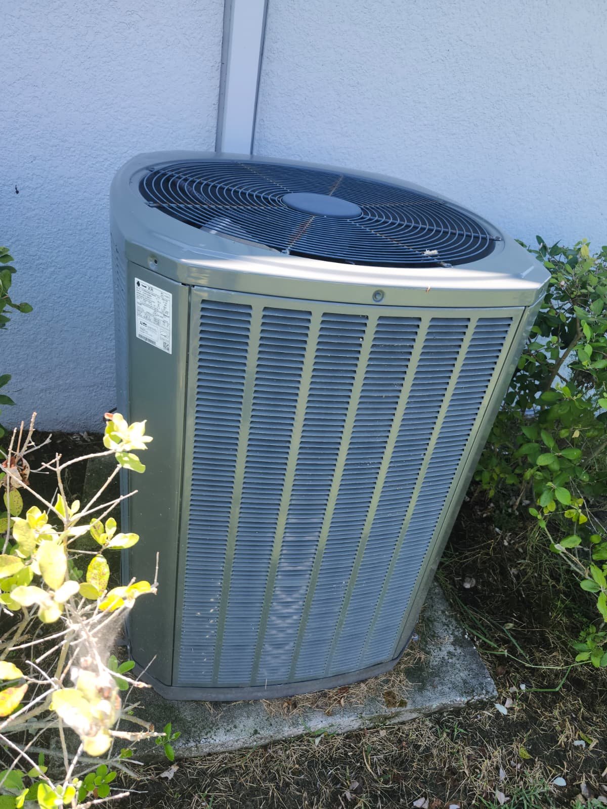 Air Conditioning Unit in Parrish, FL 34219 Exterior view of an air conditioning unit beside a house in Parrish, FL 34219.