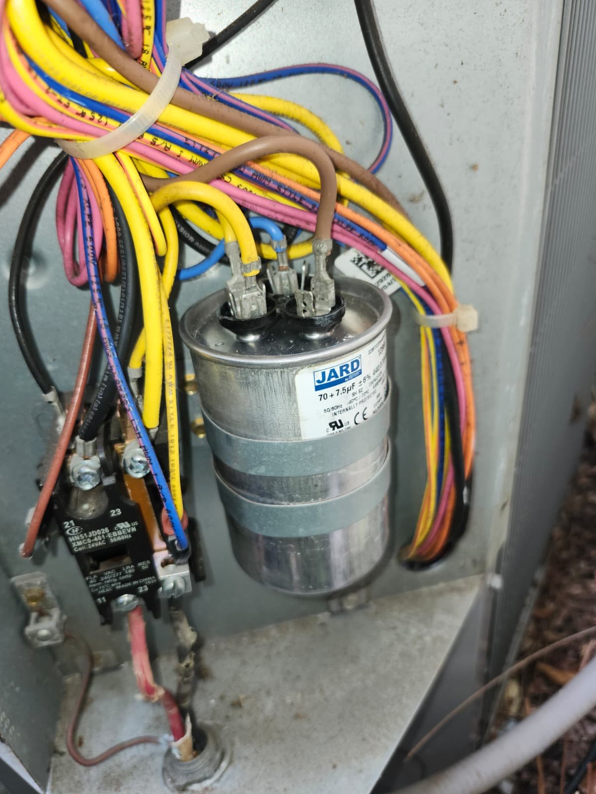 Close-up of capacitor with wiring in HVAC unit, Tampa, FL 33647.
