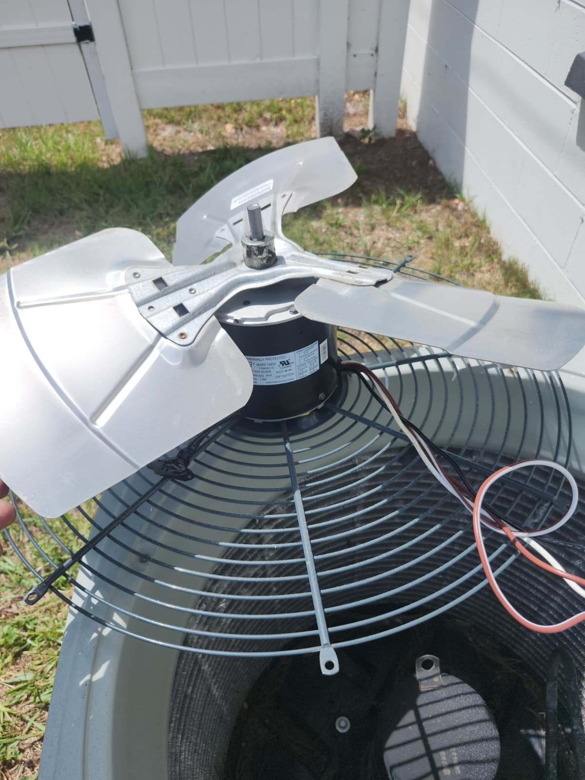 Condenser fan motor with blades attached for replacement in St. Petersburg, FL 33712.