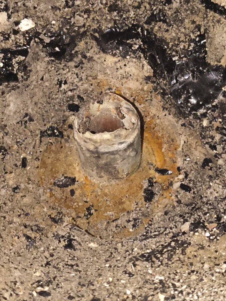 A corroded old pipe opening in Tampa, FL 33624.