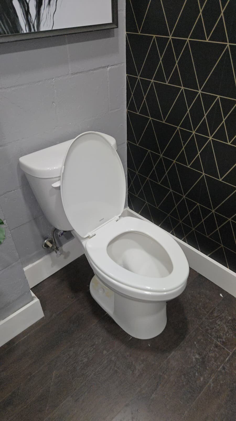 Decorative wall tiles in a bathroom with plumbing service, Tampa, FL 33605.