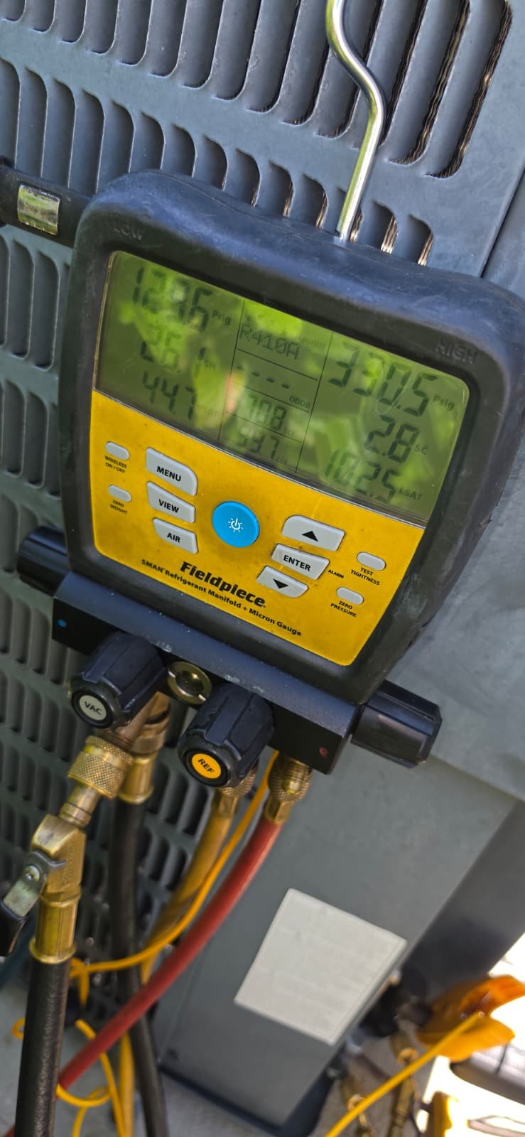 Fieldpiece digital manifold gauge on AC unit in Riverview, FL 33579.