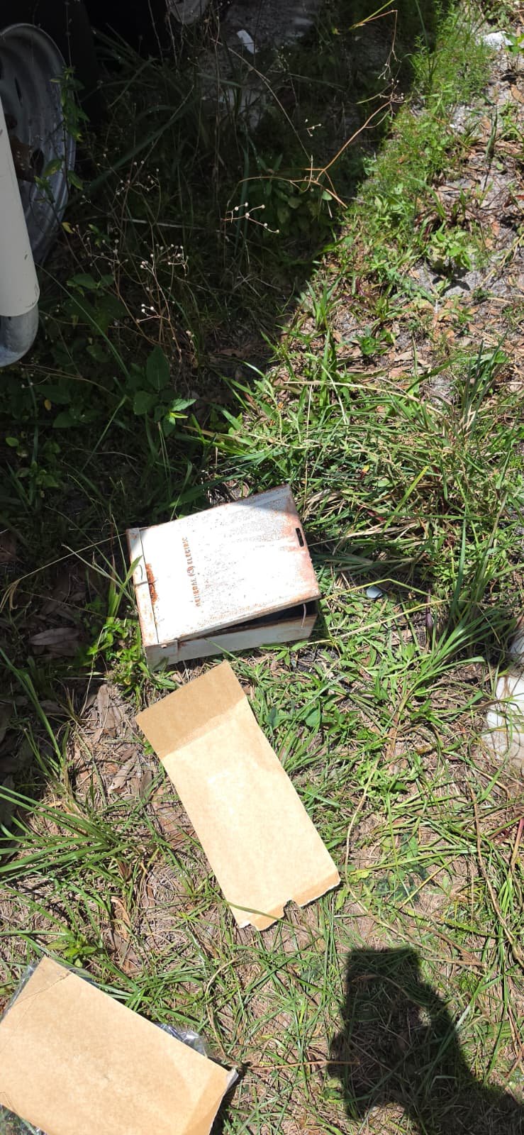 Discarded Materials in Tampa, FL 33611 Discarded old disconnect switch and packaging on the ground in Tampa, FL 33611.