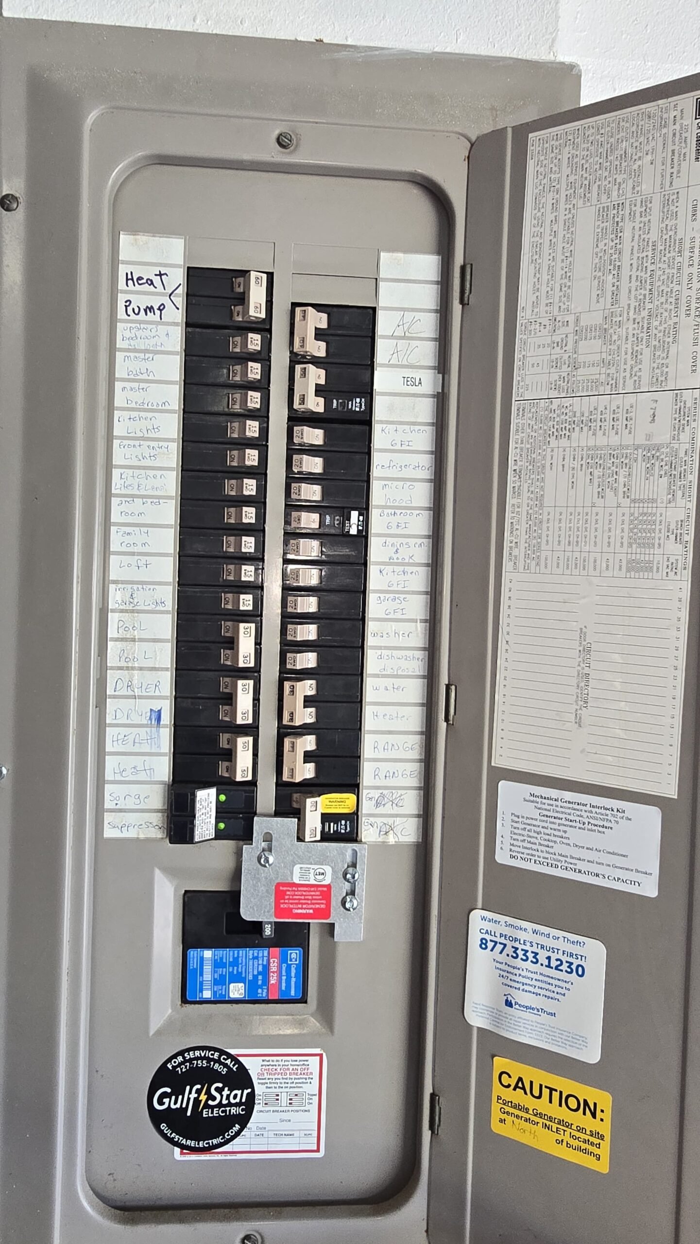 Full view of electrical panel with labeled circuits, Oldsmar, FL 34677.
