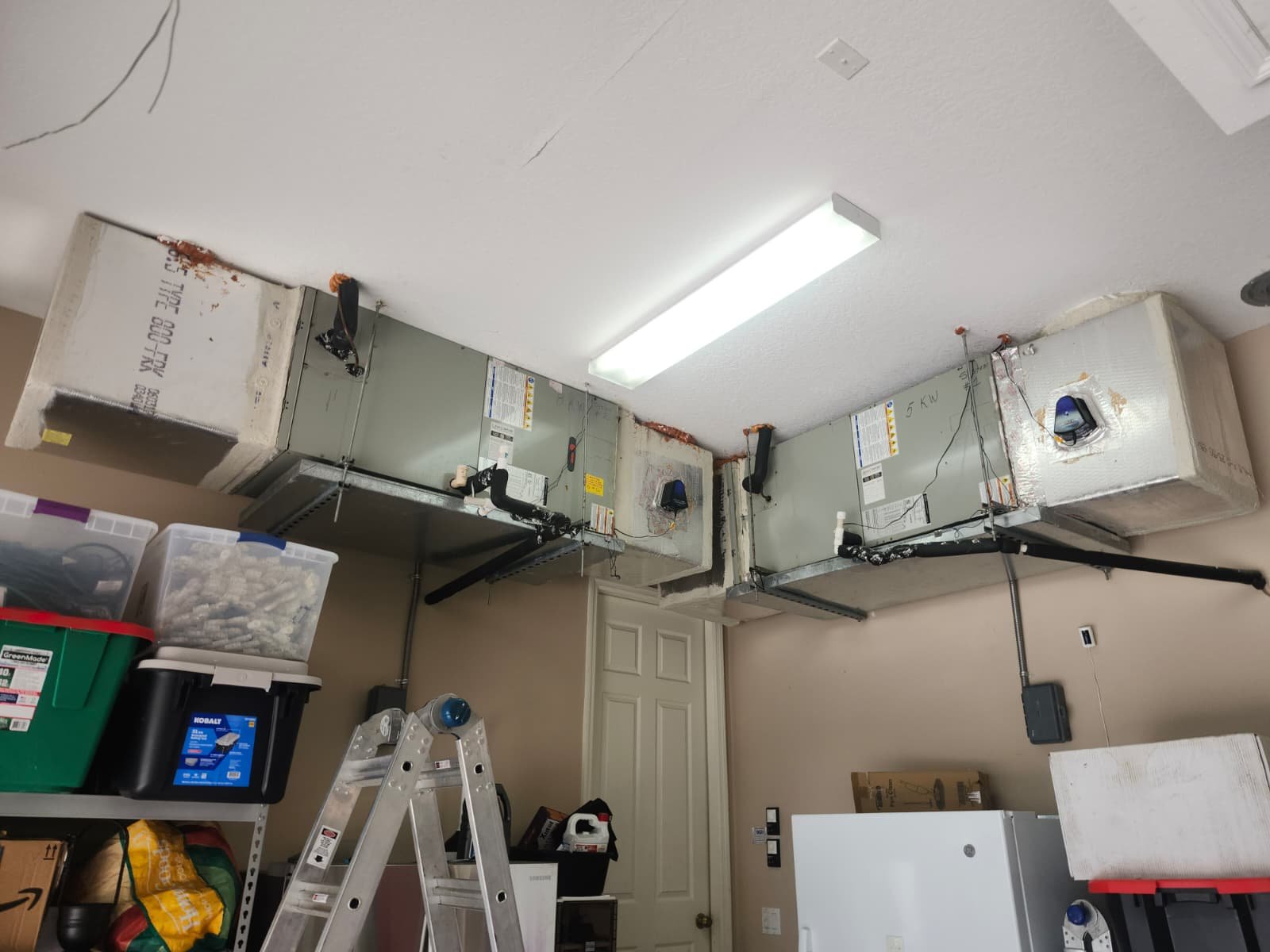 Garage Ceiling HVAC Units - Lakewood Ranch, FL 34202 Installed HVAC units in a garage ceiling at Lakewood Ranch, FL 34202.