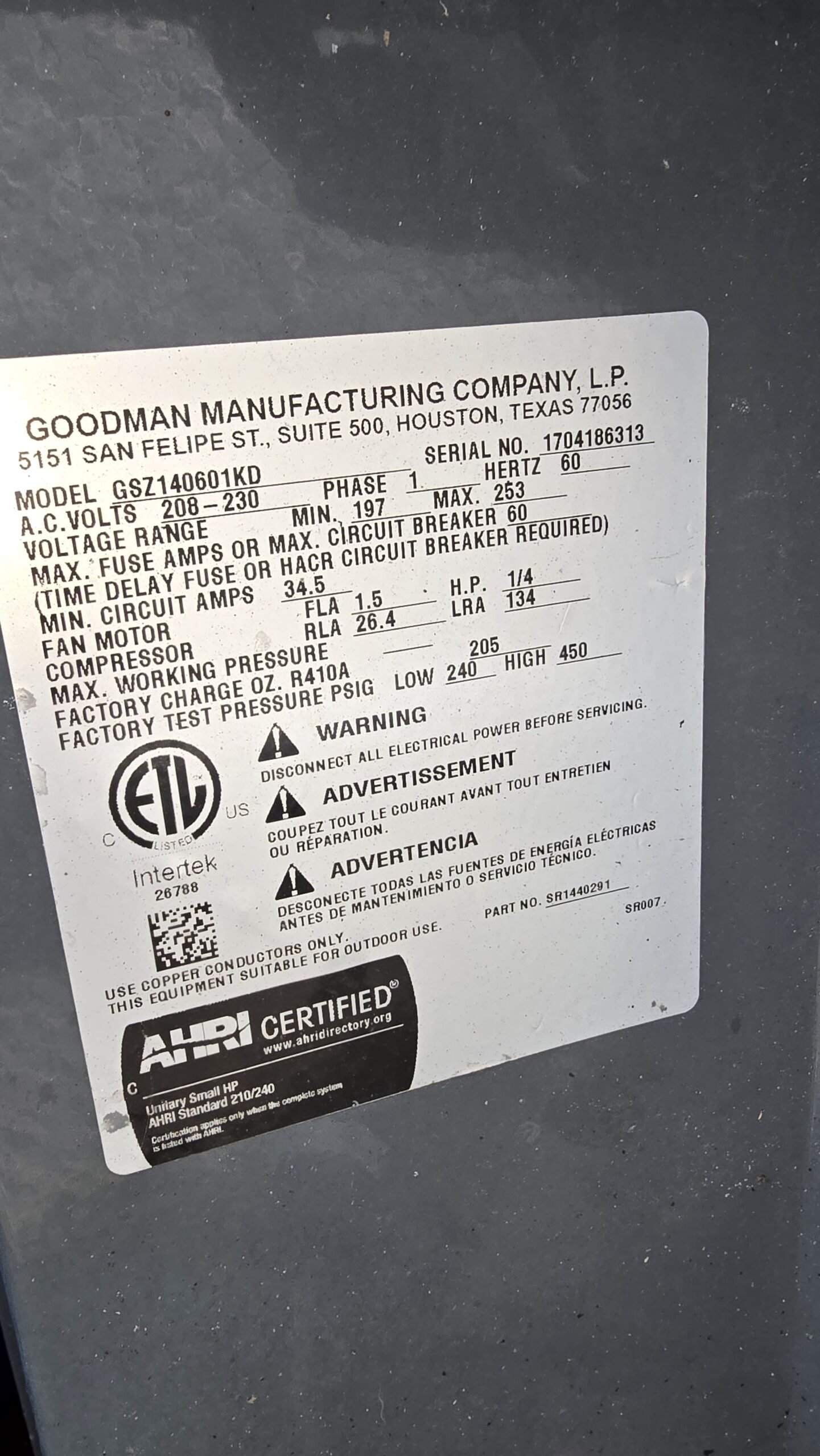 Close-up of Goodman AC unit specification label, Oldsmar, FL 34677.
