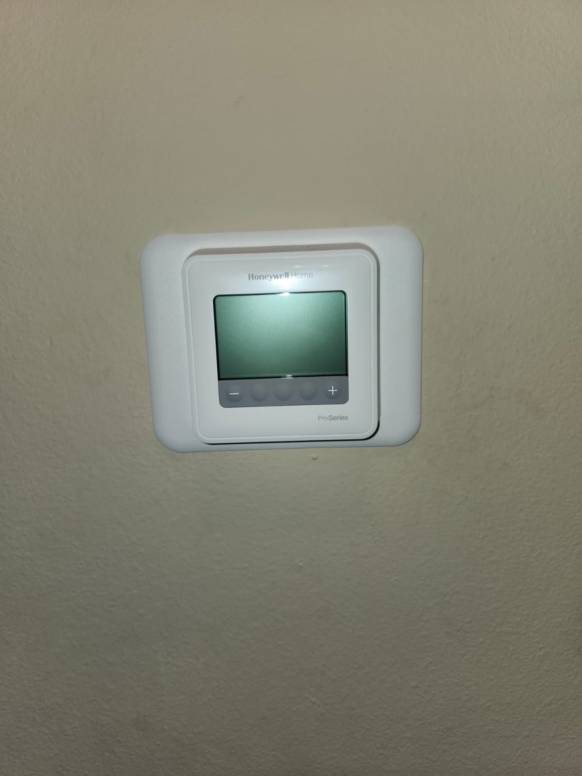 Newly installed Honeywell Home thermostat with blank screen in Lutz, FL 33559. Ready for setup.