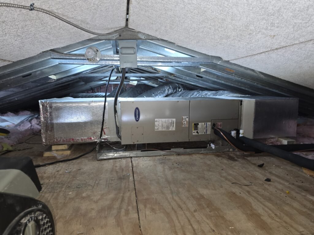 An air handler with new ductwork in an attic in Lutz, FL 33549.
