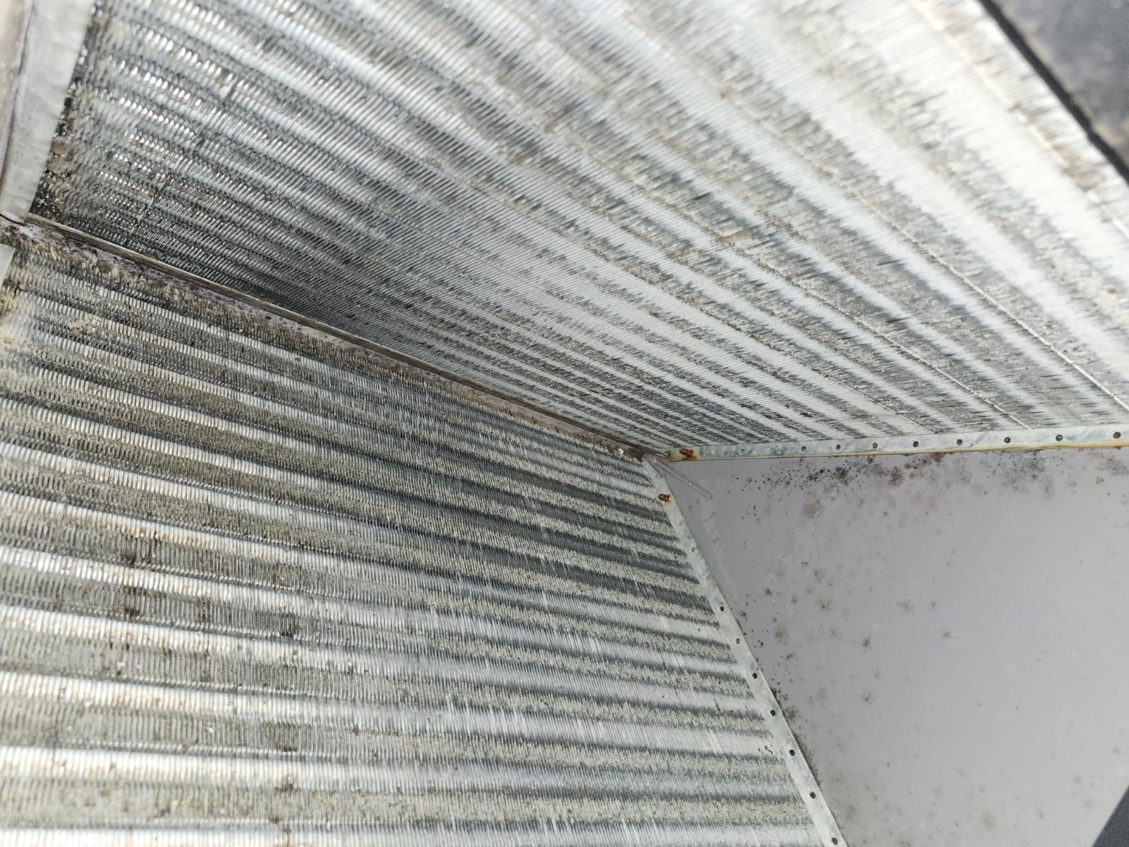 Close-up of HVAC coil showing dirt and wear, New Port Richey, FL 34655.