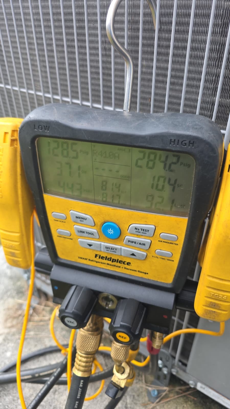 Fieldpiece digital manifold gauge set on HVAC unit, Wesley Chapel, FL 33543.