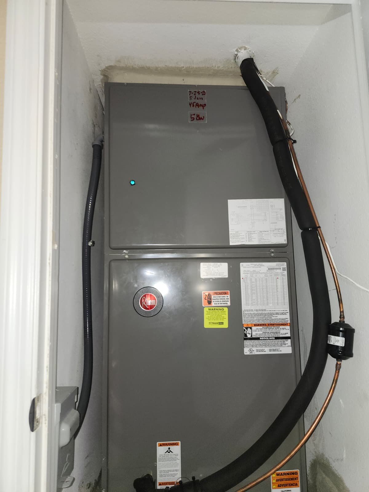Close-up of HVAC unit in closet, showcasing Value Air Duct Cleaning in Lutz, FL 33558.