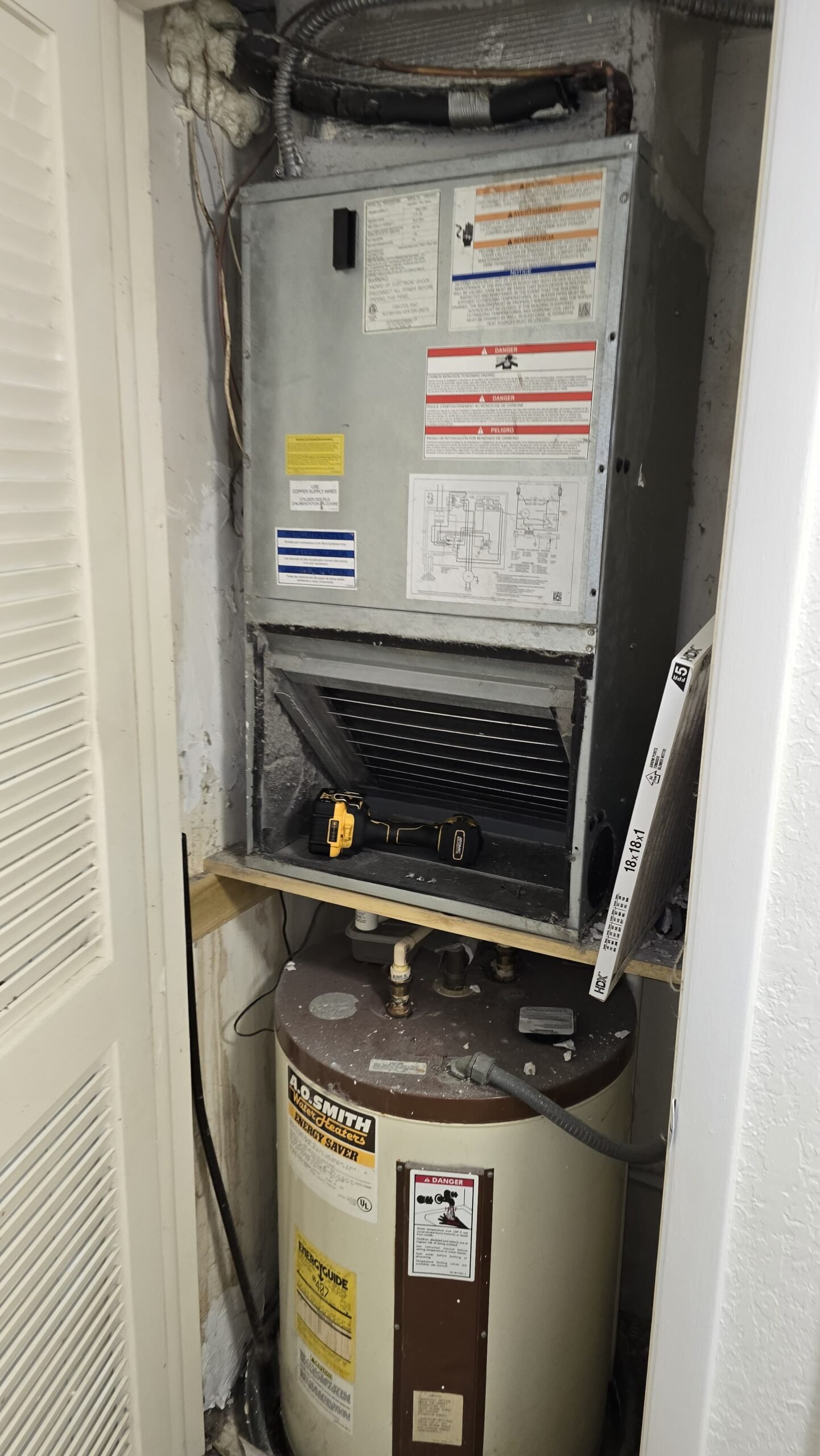 HVAC system and water heater installed in a closet, Tampa, FL 33618.