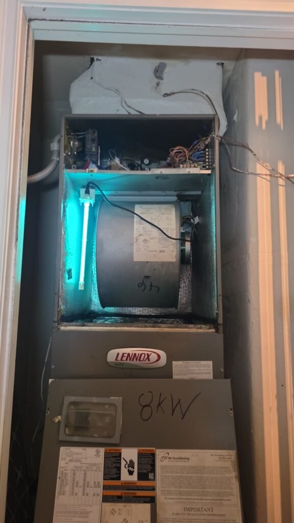 A Lennox gas furnace with its front panel off for service in Tampa, FL 33624.