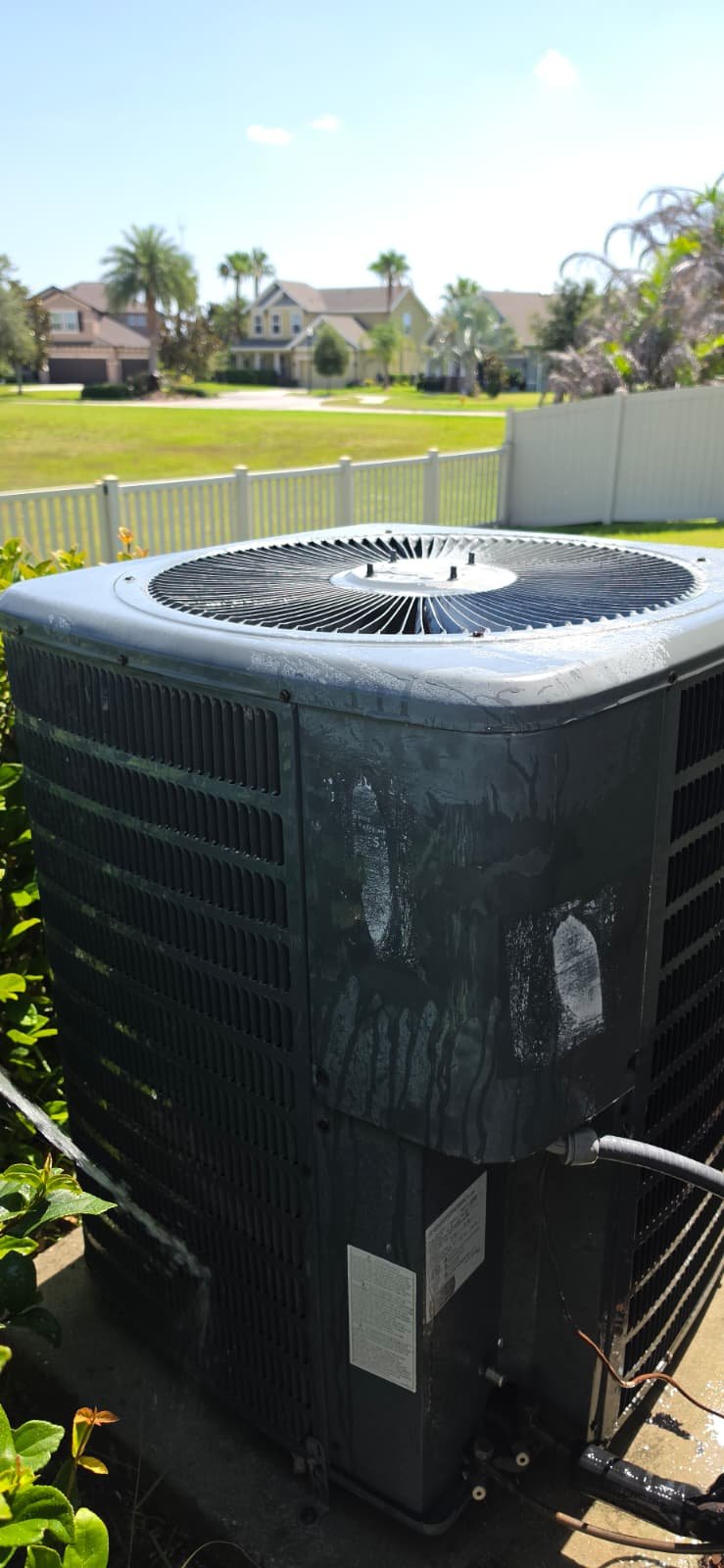 Newly installed AC unit on concrete pad in Riverview, FL 33579.