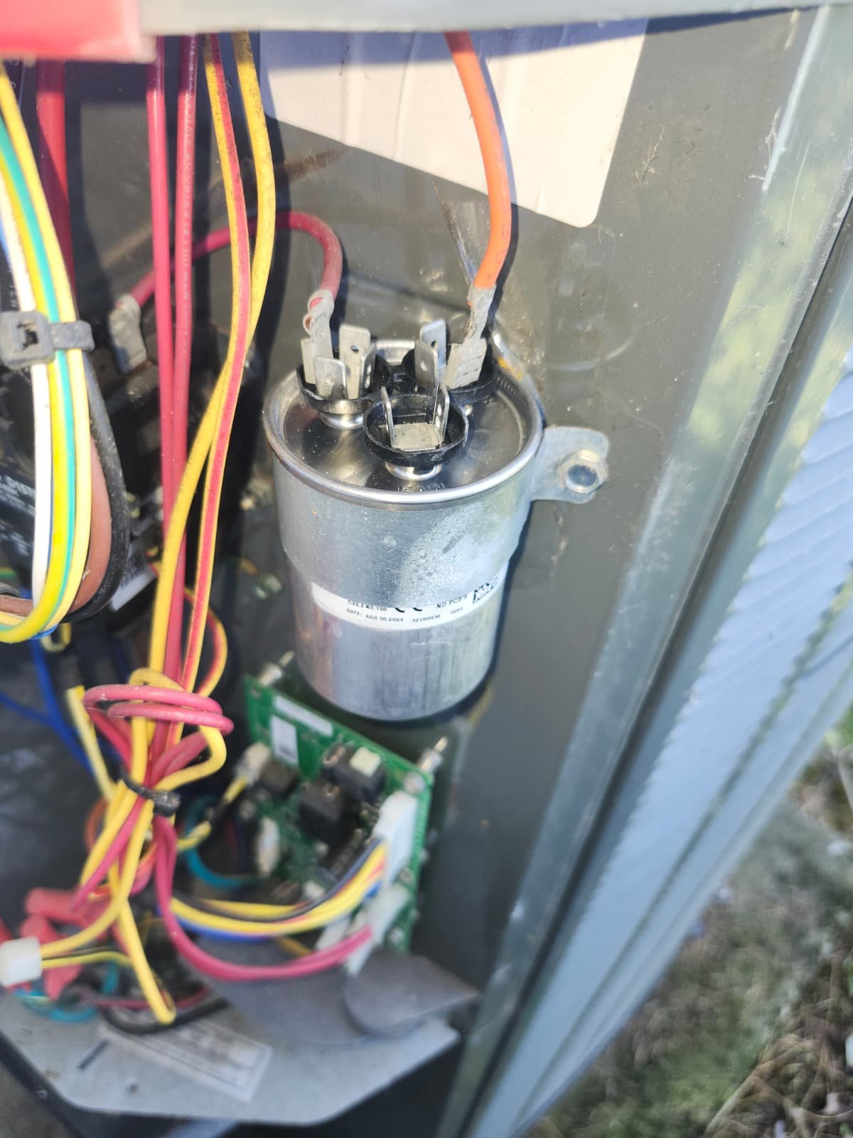 New Capacitor Installed in Parrish, FL 34219 Close-up of a new capacitor installed in an HVAC unit in Parrish, FL 34219.